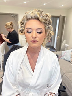 Glowing bridal makeup on Abi with a natural finish