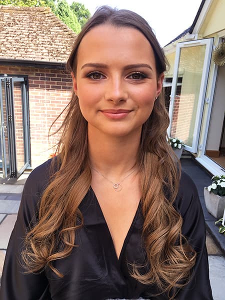 Soft glam prom look with peach tones