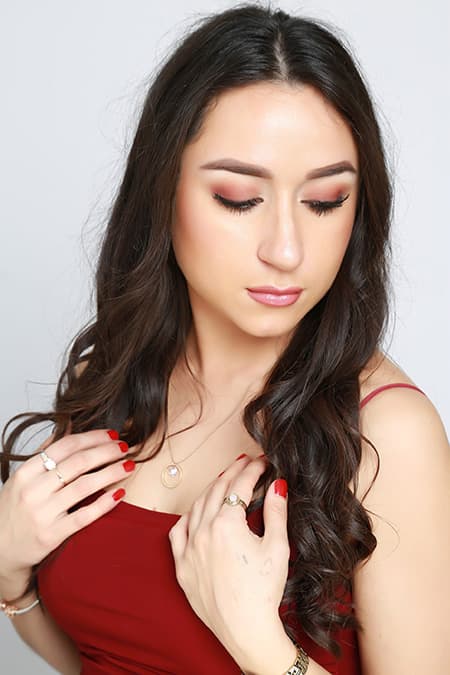 Classic red lip and winged liner makeup during photography session